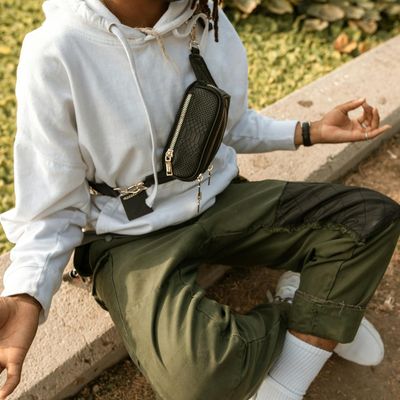 Person sitting in a calm, still meditative pose.